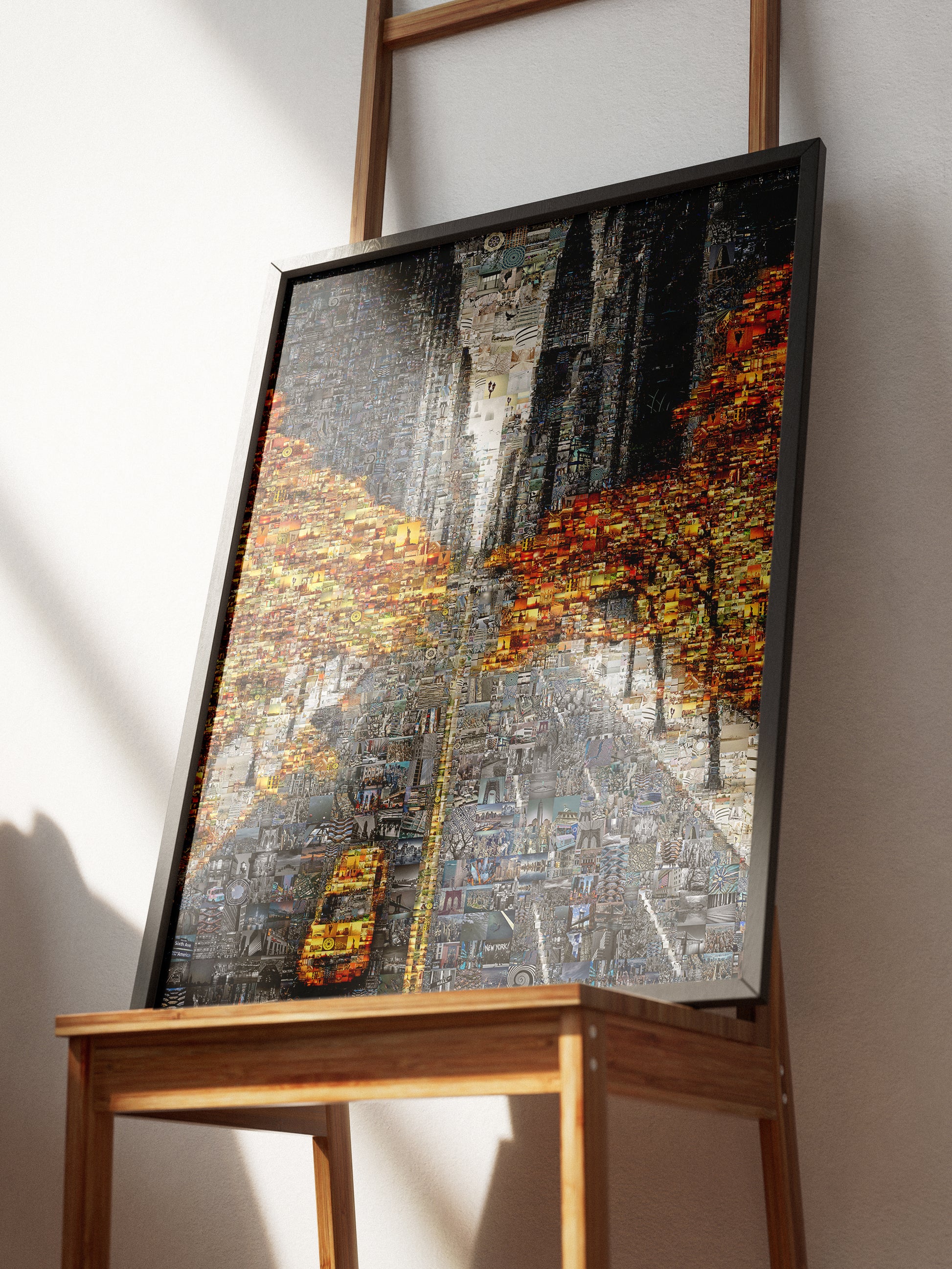 Framed custom photo mosaic artwork of a city street with yellow cabs and autumn trees on easel